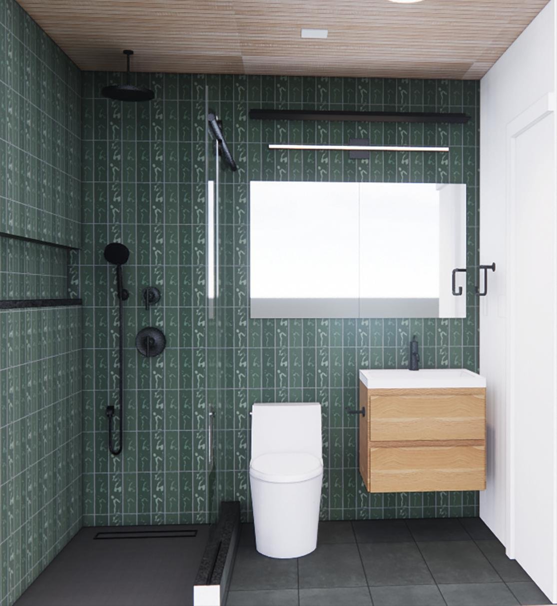 Green tiled bathroom with a wood vanity and glass shower.
