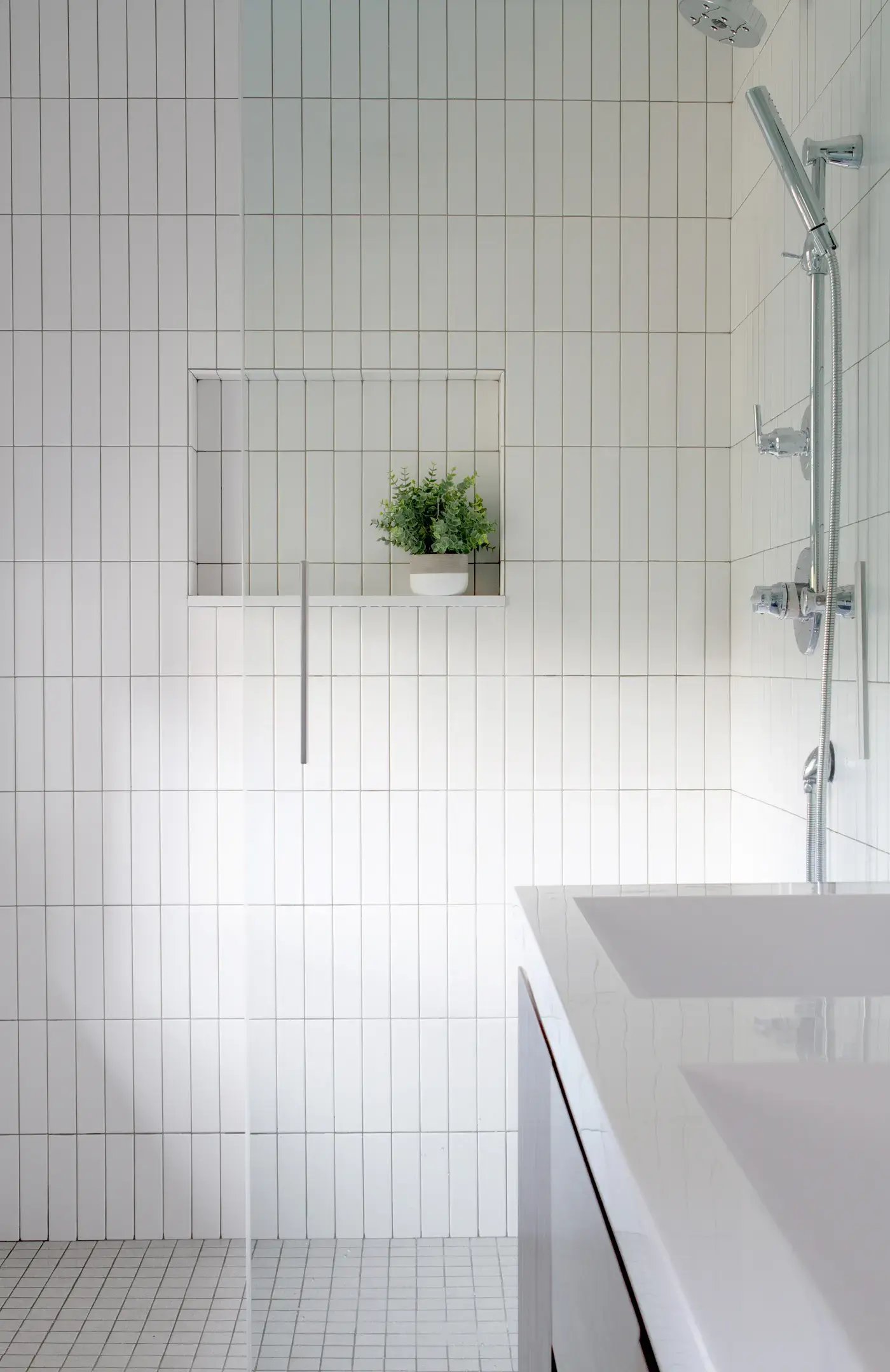 white tiled showers tall, vertical tiles