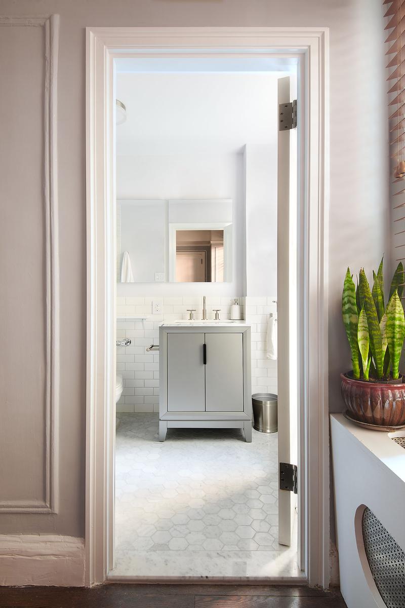 Small bathroom with marble floors