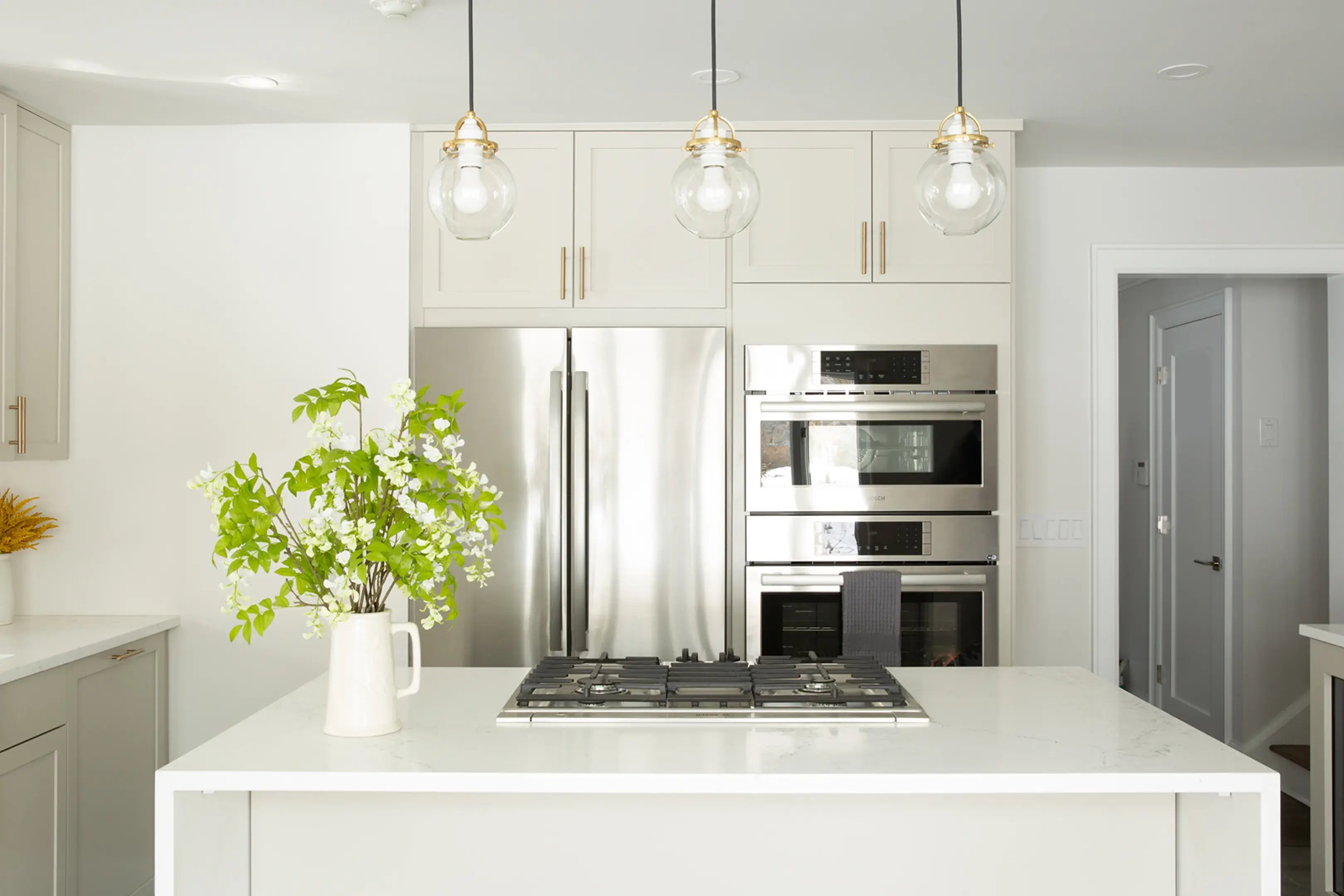 Elegant modern Westchester kitchen with silver appliances
