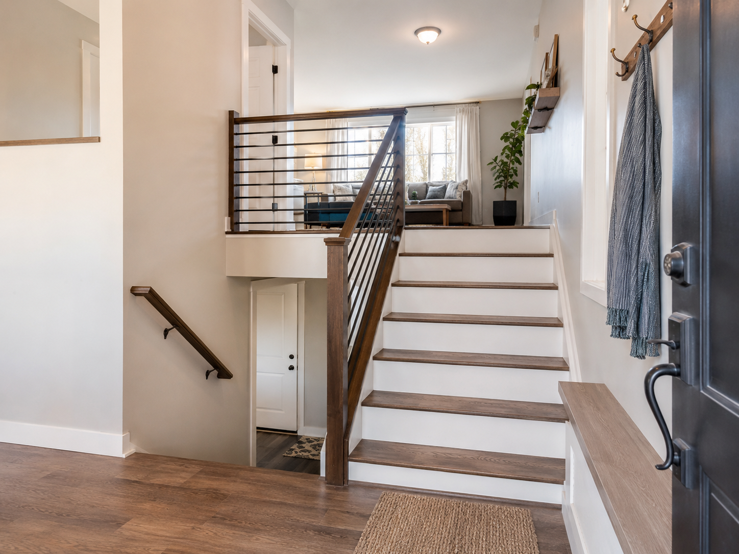 Raised ranch entryway with wooden stairs leading up.