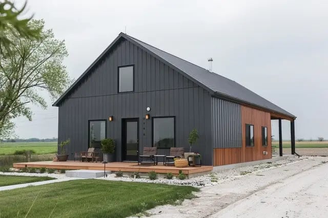  Modern charcoal metal barn house with warm wood accents.