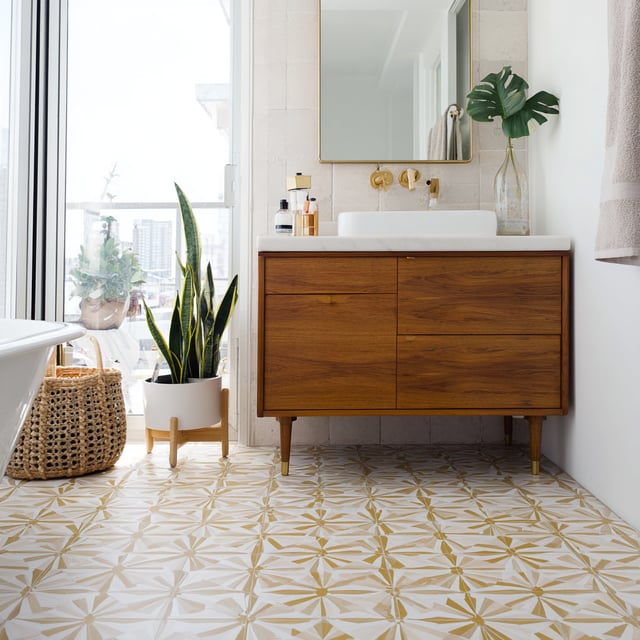 Bright modern bathroom featuring wood vanity and patterned floor tile.